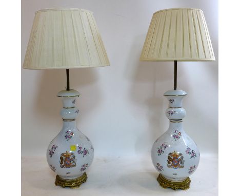 A pair of Chinese porcelain table lamps with armorial crest, H.50cm 