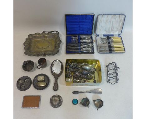An assorted collection of silver and silver plated ware, to include a silver backed hand mirror with embossed floral decorati