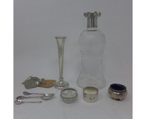 A cut glass decanter with scalloped silver lid, Birmingham 1904, H.24cm, together with a filled silver tulip vase, Birmingham