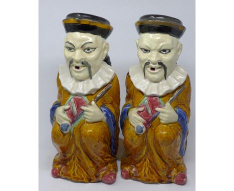 A pair of Victorian glazed ceramic jugs in the form of a seated Chinese figure, H.31cm 