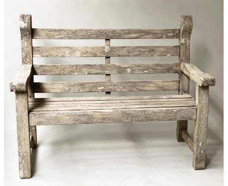 GARDEN BENCH, weathered teak of compact substantial form with flat top arms and rounded Lutyens style detail, 123cm W. 