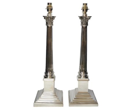 A pair of plated Corinthian column lamp bases, 56cm high including fitting. Condition - good