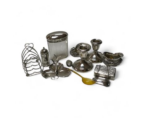 A group of mixed silver including a five bar toastrack, pair of dwarf candlesticks, 19th century snuff box, ring tree dish, c