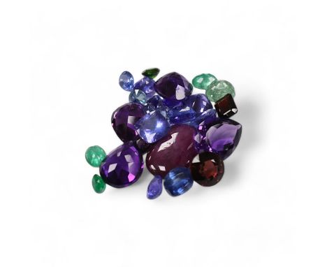 A small collection of unmounted cut gemstones, including amethyst, emerald and ruby, etc. Condition - fair