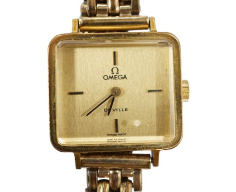A lady's steel and gold plated Omega De Ville manual wind wrist watch, on an associated gold plated bracelet. Condition - poo