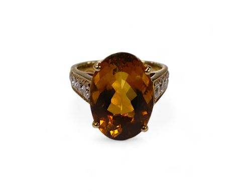 A  modern 18k and single stone oval cut citrine set dress ring, with ten stone graduated diamond set shoulders, size K, gross