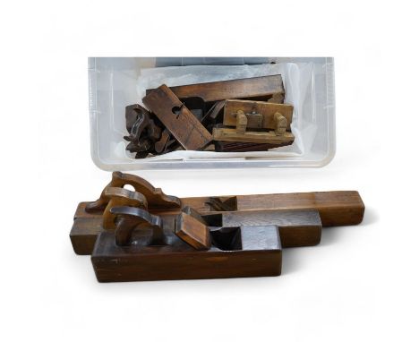 A collection of wooden carpenters tools, including various planes, two saws and a marking gauge, longest plane 73cm long. Con