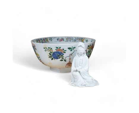 A Chinese famille verte bowl, Kangxi period and a white glazed figure of Guanyin, bowl 22cm diameter. Condition - figure good