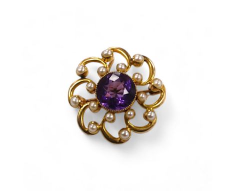 A yellow metal, amethyst and seed pearl cluster set circular pendant brooch, 24mm, gross weight 6.3 grams. Condition - fair t