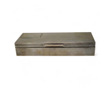 A George V engine turned silver mounted rectangular cigarette box, London, 1935, 21.7cm. Condition - poor