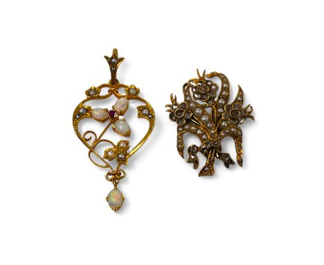 An Edwardian 9ct, white opal, seed pearl and ruby set drop pendant, 43mm, together with a yellow metal , seed pearl and rose 