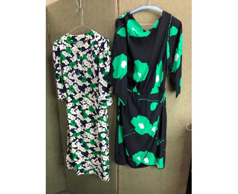 A CELINE PARIS BLUE, WHITE AND GREEN FLORAL PRINT DRESS SIZE 40, AND A FURTHER SCOOP BACK DRESS OF SIMILAR COLOURS.