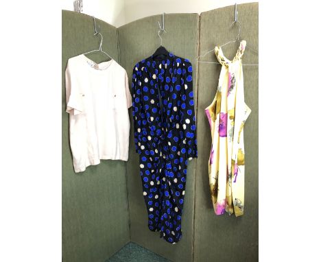 A LONG BLACK DRESS WITH BLUE AND CREAM SPOTS AND BUTTON FRONT, TOGETHER WITH A GEORGE GROSS SIZE 12 YELLOW HALTER NECK DRESS 