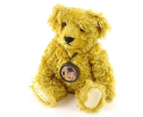 A Steiff Gustav Klimt limited edition bear, with white label to ear, wearing a bronze and ceramic medallion, sold with origin