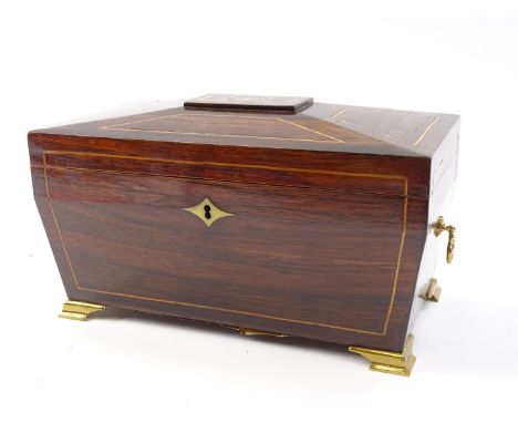 A Regency rosewood inlaid and metal bound tea caddy, the lid hinging to reveal a plain interior within a moulding to the unde