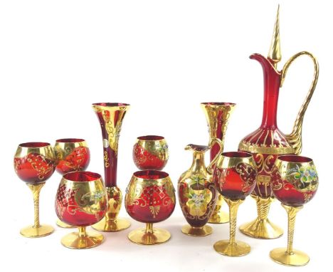 A collection of Venetian ruby tinted glass, each highly decorated with raised enamel flowers, on a gilt ground, to include a 