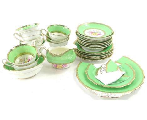 A Royal Albert part tea service, printed and painted with a flower spray on a green ground, some pieces (AF)