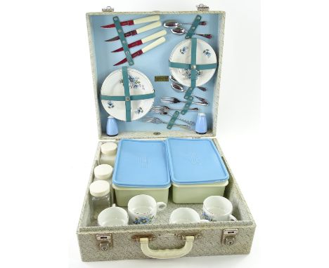 A Brexton picnic set for four place settings, with ceramic cups etc.