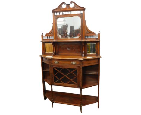 A late Victorian walnut side cabinet, the top with a swan neck pediment above a bevelled mirrored plate, and a shelf, with tw