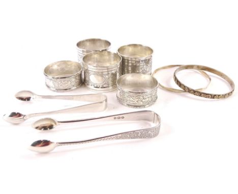 A quantity of small silver etc., to include napkin rings, sugar tongs and a part silver bangle.