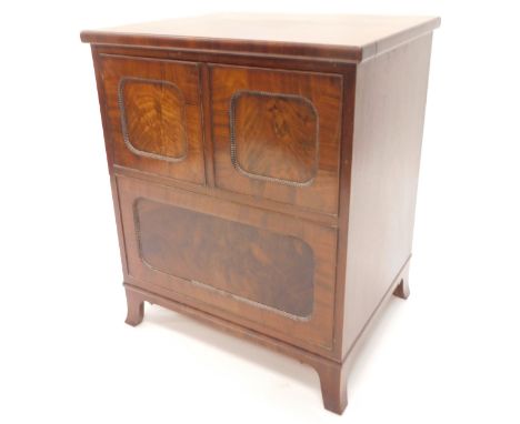 A 19thC mahogany night commode, the hinged lid with two panelled doors each with beaded borders enclosing a fitted interior w