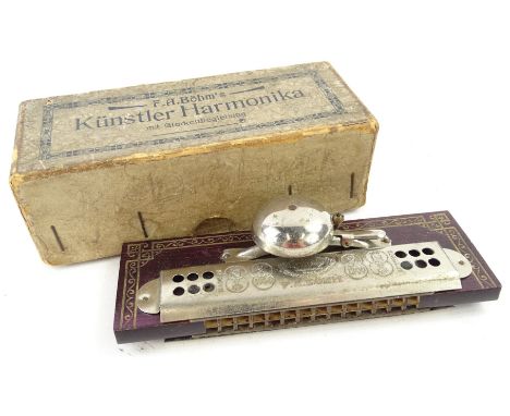 An early 20thC Kunstler Bohm harmonica, with chrome plated mounts, 14cm W.