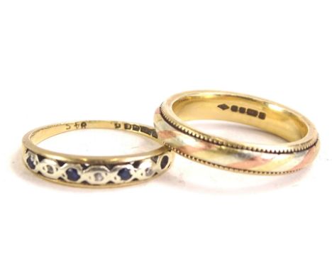 Two 9ct gold dress rings, to include a blue and white stone set half hoop eternity ring, 1.2g all in, and a tricolour design 