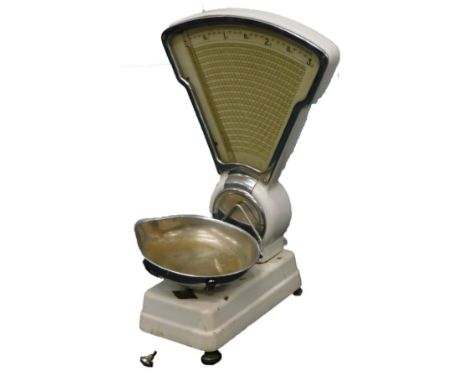 A set of white enamel shop scales, with chrome fittings etc.