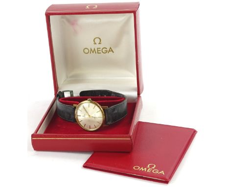 A 1960s Omega Geneva gentleman's gold plated wristwatch, having sun burst silver dial with applied stick markers and minute t