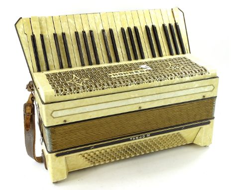 A Hohner piano accordion, with simulated marble case, no carrying case.