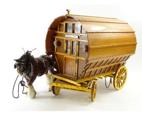 A model of a Romany or Gypsy caravan, titled Romany Rose and an associated ceramic shire horse.