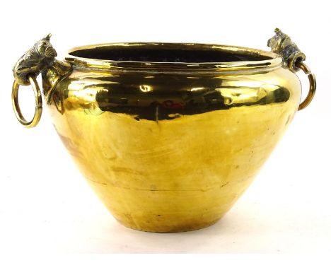 An Eastern brass jardiniere, with Indian style elephant, ring handles, 50cm W.