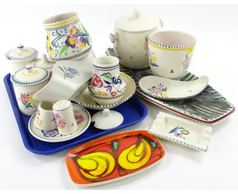 A large quantity of Poole pottery, to include two Delphis leaf shaped dishes, three preserve jars and covers etc.