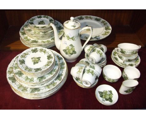 Royal Worcester, approximately sixty-three pieces of 'The Worcester Hop, Mathon' decorated coffee and dinnerware.