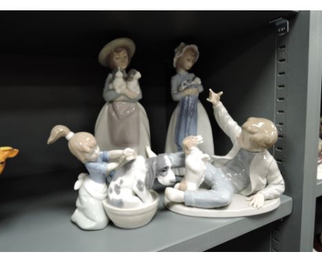 Four figure studies three by Nao and similar Lladro bathing dog