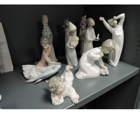 Nine figure studies by Lladro including sleeping angel, girl with chicken, girl with chamber stick etc