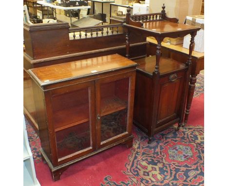 An Edwardian mahogany coal purdonium with a shaped raised back and shelf, on turned supports, 48cm wide, 113cm high, together