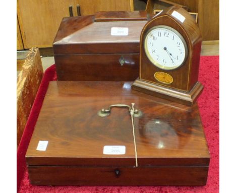 A mahogany tea caddy of sarcophagus shape, (interior lacking), 34cm wide, a mahogany rectangular box with carrying handle, (i