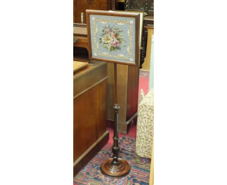 A Victorian stained wood pole screen with square-shaped floral panel, on circular base, 135cm high, (a/f), a gilt-framed mirr
