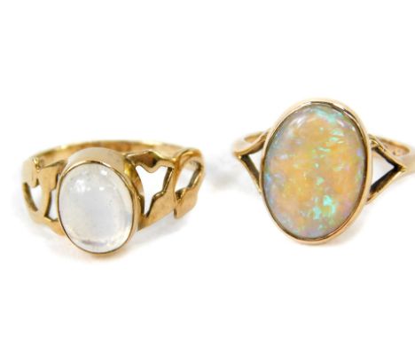 A 9ct gold and opal ring, oval set, size L/M, and a 9ct gold and moonstone ring, high set, size L, 4.5g. (2)