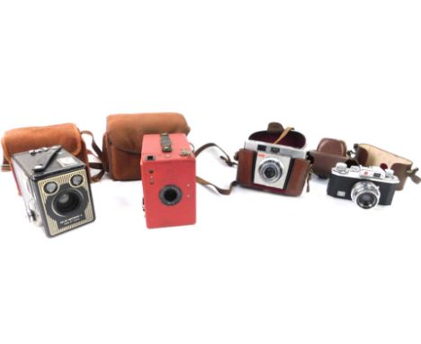 A Halina 35X camera, with 1:3.5X=45mm lens, 6-20 Brownie E camera, Kodak Colorsnap 35 camera model II, and a Portrait Hawkeye