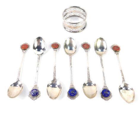 A silver napkin ring, Sheffield 1956, 0.48oz, together with six coffee spoons with enamel terminals, white metal, stamped 800