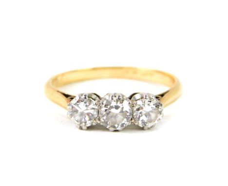 An 18ct gold and diamond three stone ring, approx 0.8cts, size K, 2.2g.