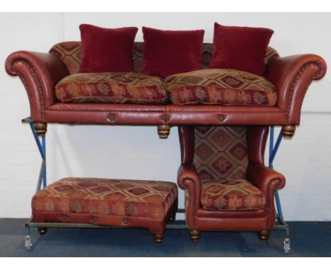 A studded red leather and tapestry Chesterfield sofa, with assorted cushions, raised on turned feet, 250cm W, together with a