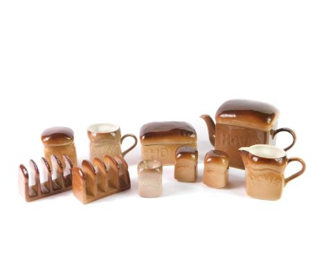 A Carltonware pottery part breakfast set, decorated in the Hovis Bread shape, comprising teapot, cream jug, sucrier, mug, thr