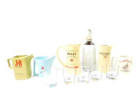 A Schwepps glass soda syphon, five advertising water jugs, comprising Bells Old Scotch Whisky, Whyte and Mackay, J &amp; B Sc