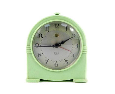 A Smiths mid 20thC electric alarm clock, circular silvered dial, centre seconds, with alarm aperture, apple green Bakelite ca