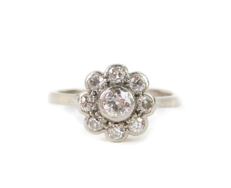 An 18ct white gold and platinum and diamond daisy ring, set with nine brilliant cut diamonds, approx 0.5cts, size L, 3.2g.