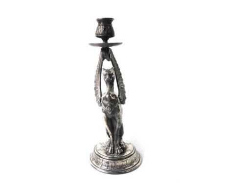 A late 19thC French silver plated candlestick, of figural form, cast with a Griffin, raised on a circular base, 30.5cm H.