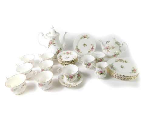 A Royal Albert porcelain part tea and coffee service, decorated in the Moss Rose pattern, comprising tea pot, coffee pot, cre